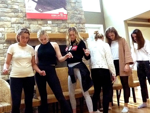 Volunteers dance at a Chicago area sorority hypnosis show.